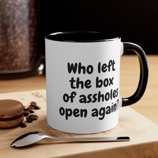 black 11oz mug with funny "Who left the box of assholes open again?"