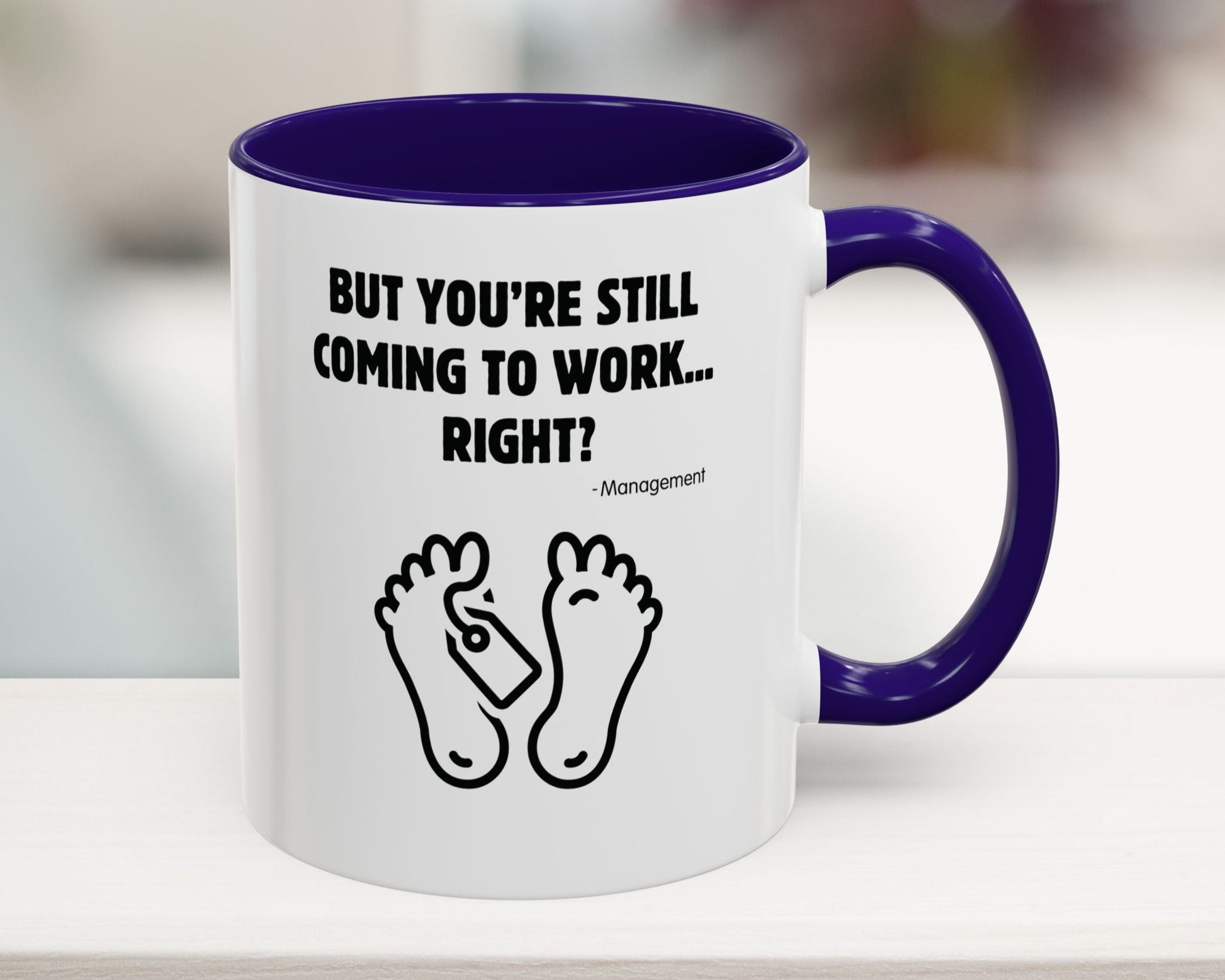 White mug with purple interior and handle, featuring text and foot illustrations on a blurred background.