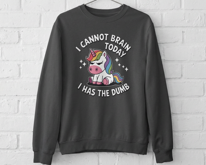Gray sweatshirt with a unicorn graphic and text on a white brick wall background