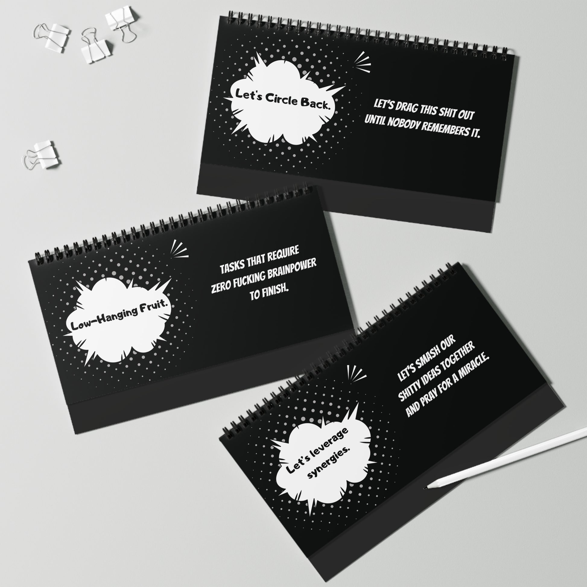 Three black spiral-bound pages with white text on a gray background