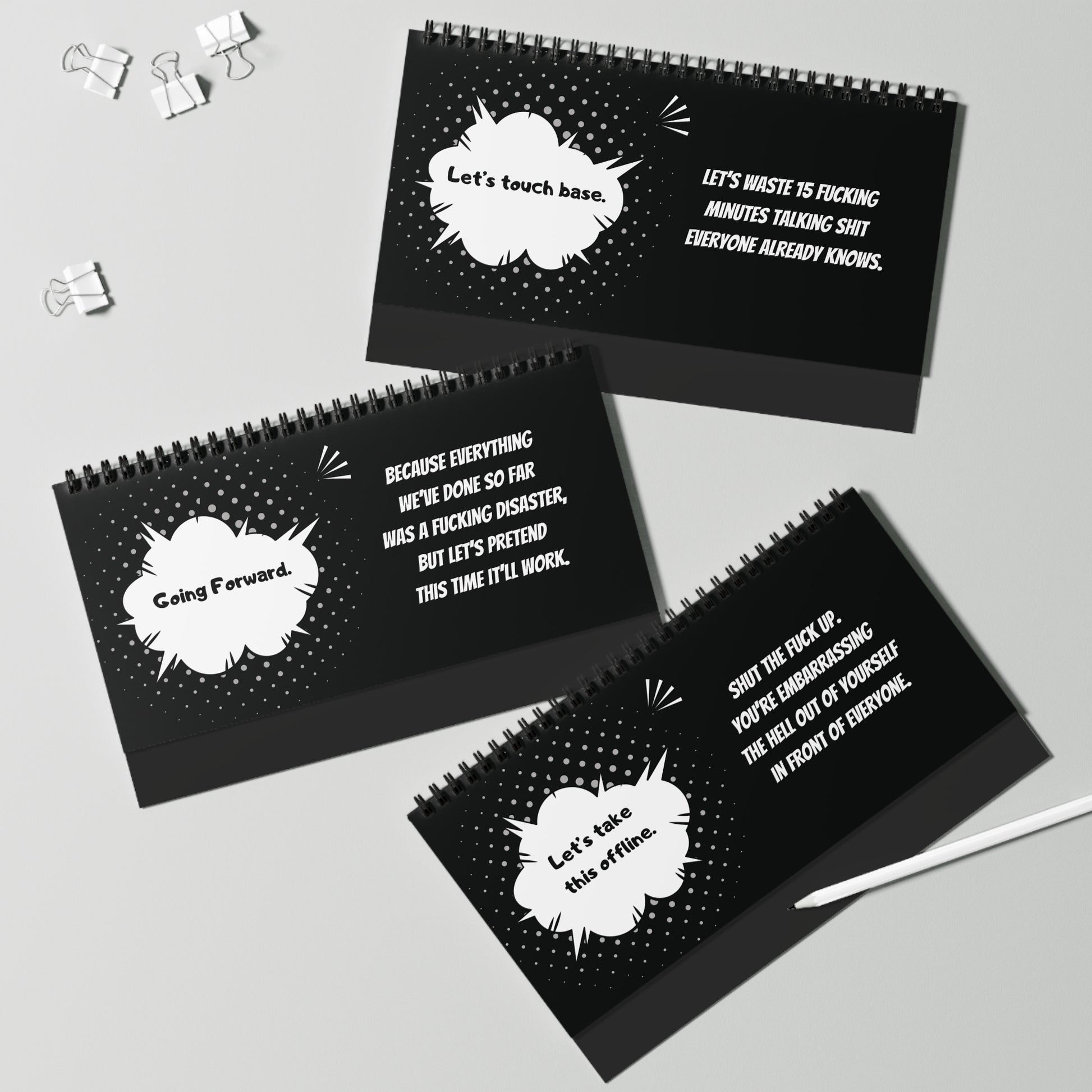 Three black spiral-bound pages with white text and speech bubble designs on a gray background.