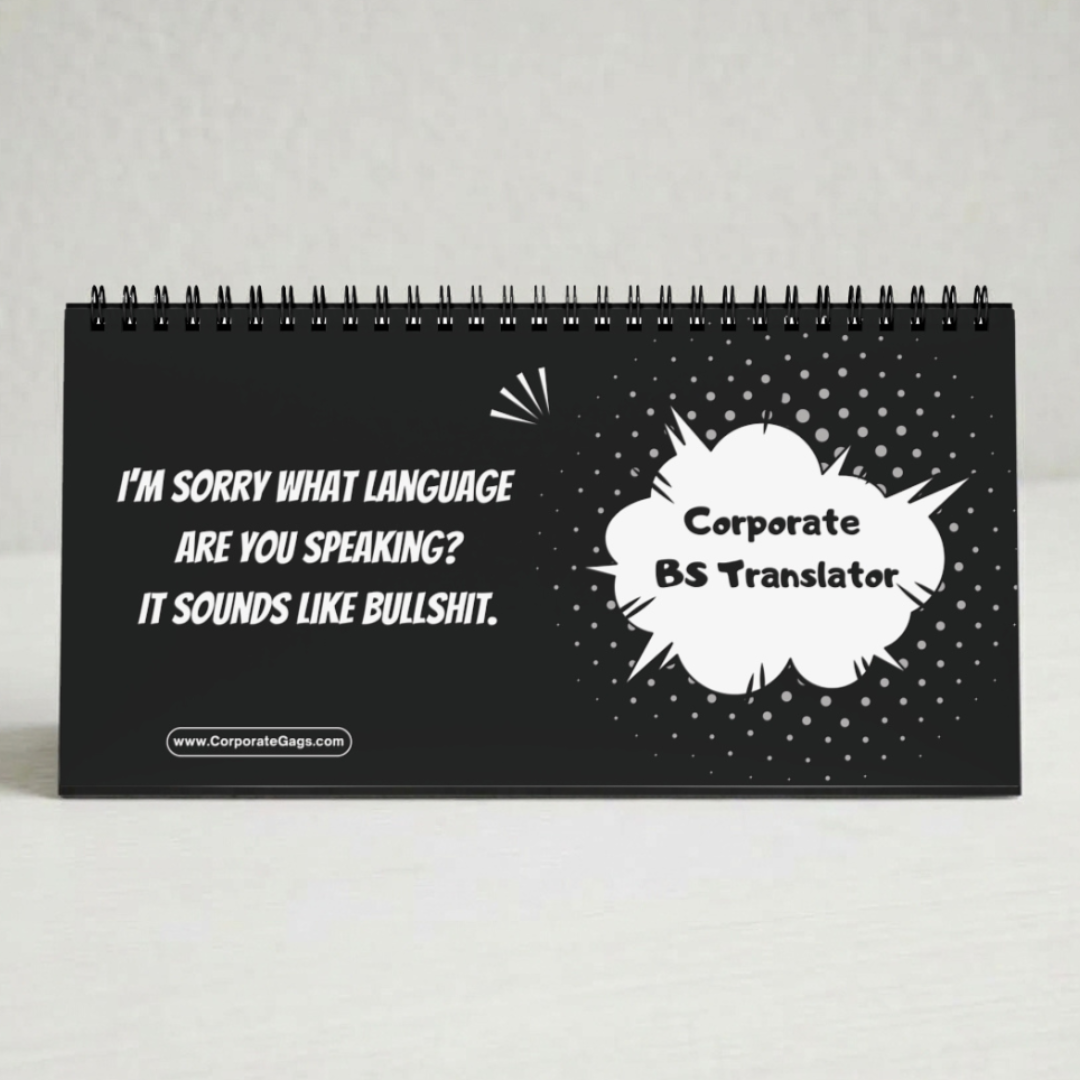 A black spiral-bound desk calendar or sign with white text that reads, 'I'M Sorry WHAT LANGUAGE ARE YOU SPEAKING? IT SOUNDS LIKE Bullshit.' and a speech-bubble graphic reading 'Corporate BS Translator.