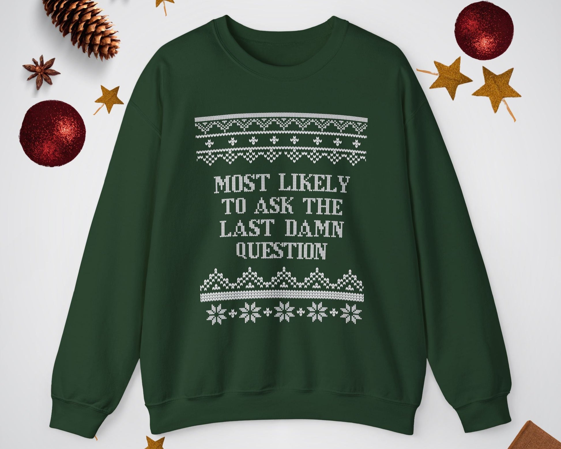 Green sweatshirt with text and patterns on a white background with decorative items.