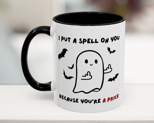 Mug with ghost illustration and text on a white surface