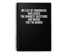 Black spiral notebook with darkly funny quote about coworkers