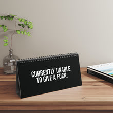 Office humor desk sign showing “I’M ON MUTE FOR A REASON” in a work-from-home setup