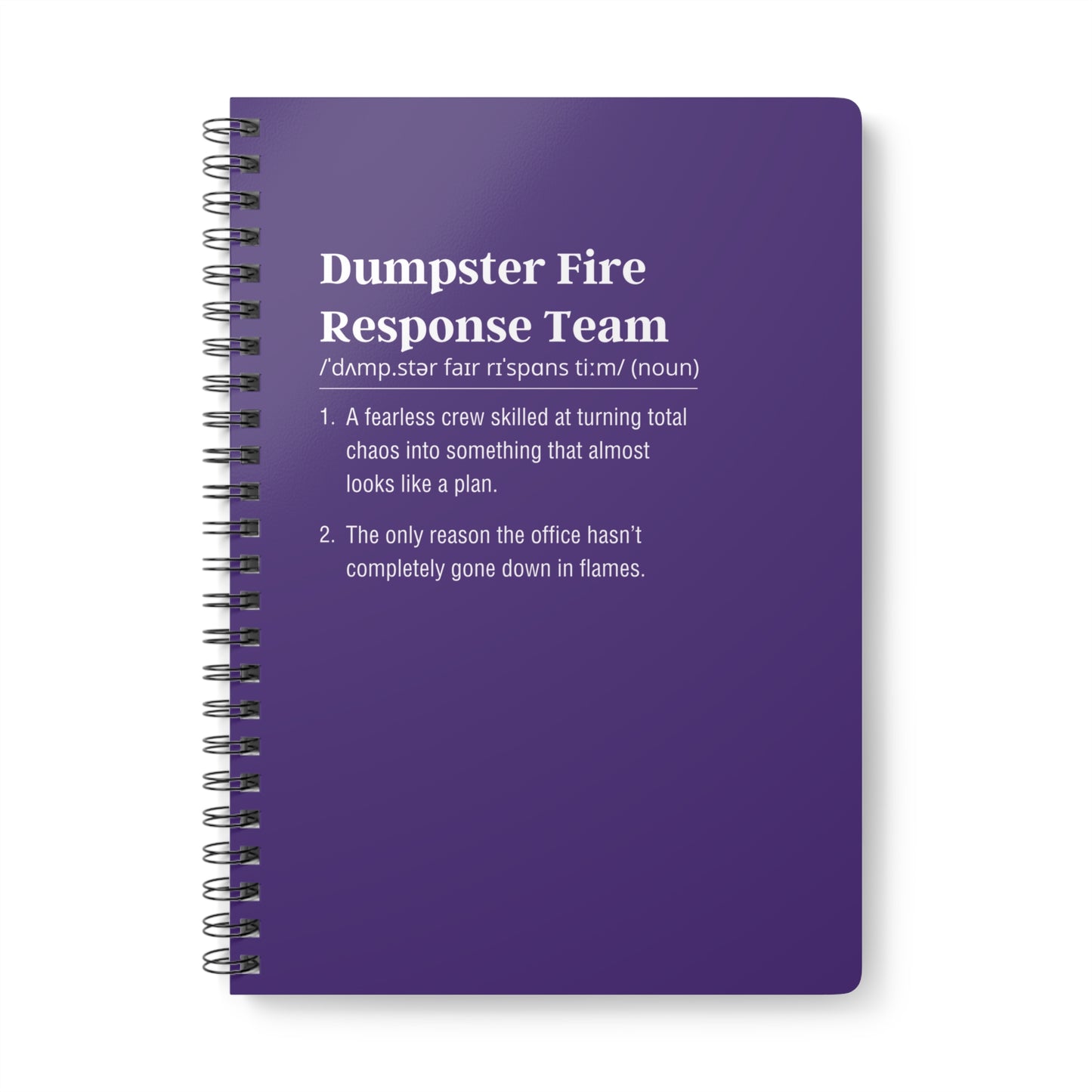 Purple notebook with text definition on a white background