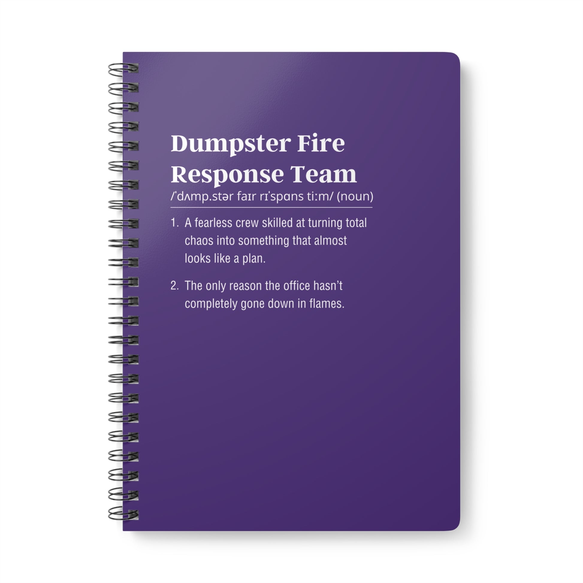 Purple notebook with text definition on a white background