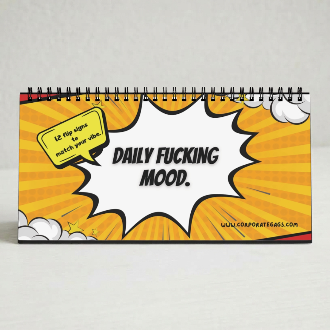 A spiral-bound desk calendar with a comic book style cover featuring a yellow and orange sunburst background, a white speech bubble, and the text 'DAILY FUCKING MOOD.' on the front.