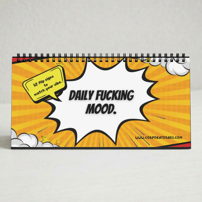A spiral-bound desk calendar with a comic book style cover featuring a yellow and orange sunburst background, a white speech bubble, and the text 'DAILY FUCKING MOOD.' on the front.