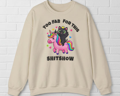 Beige sweatshirt with a graphic of a black cat on a unicorn and text 'Too Fab For This Shitshow' on a white background