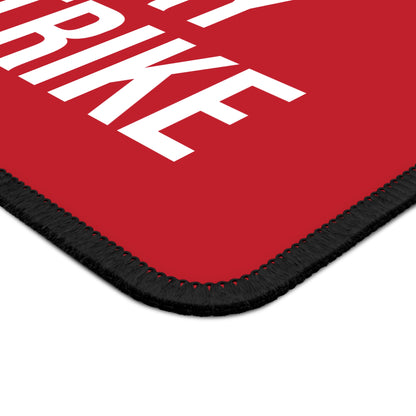 Close-up of dark red neoprene mouse pad with stitched edges