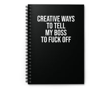 Black notebook with white text on a white background