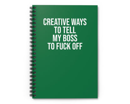 Green notebook with white text on a white background