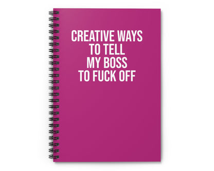 Pink notebook with white text on a white background