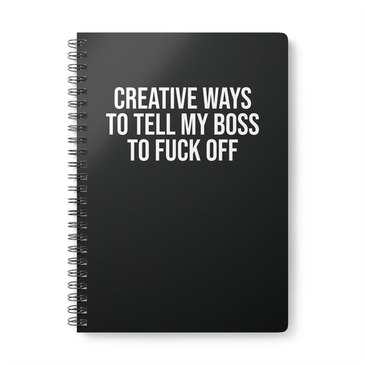 Black notebook with white text on a white background