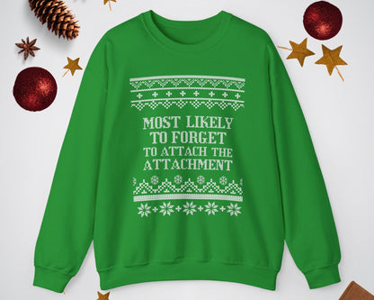 Green sweatshirt with white text and patterns on a light gray background with Christmas decorations.