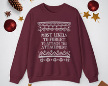 Maroon sweatshirt with Christmas-themed text and decorations on a white background