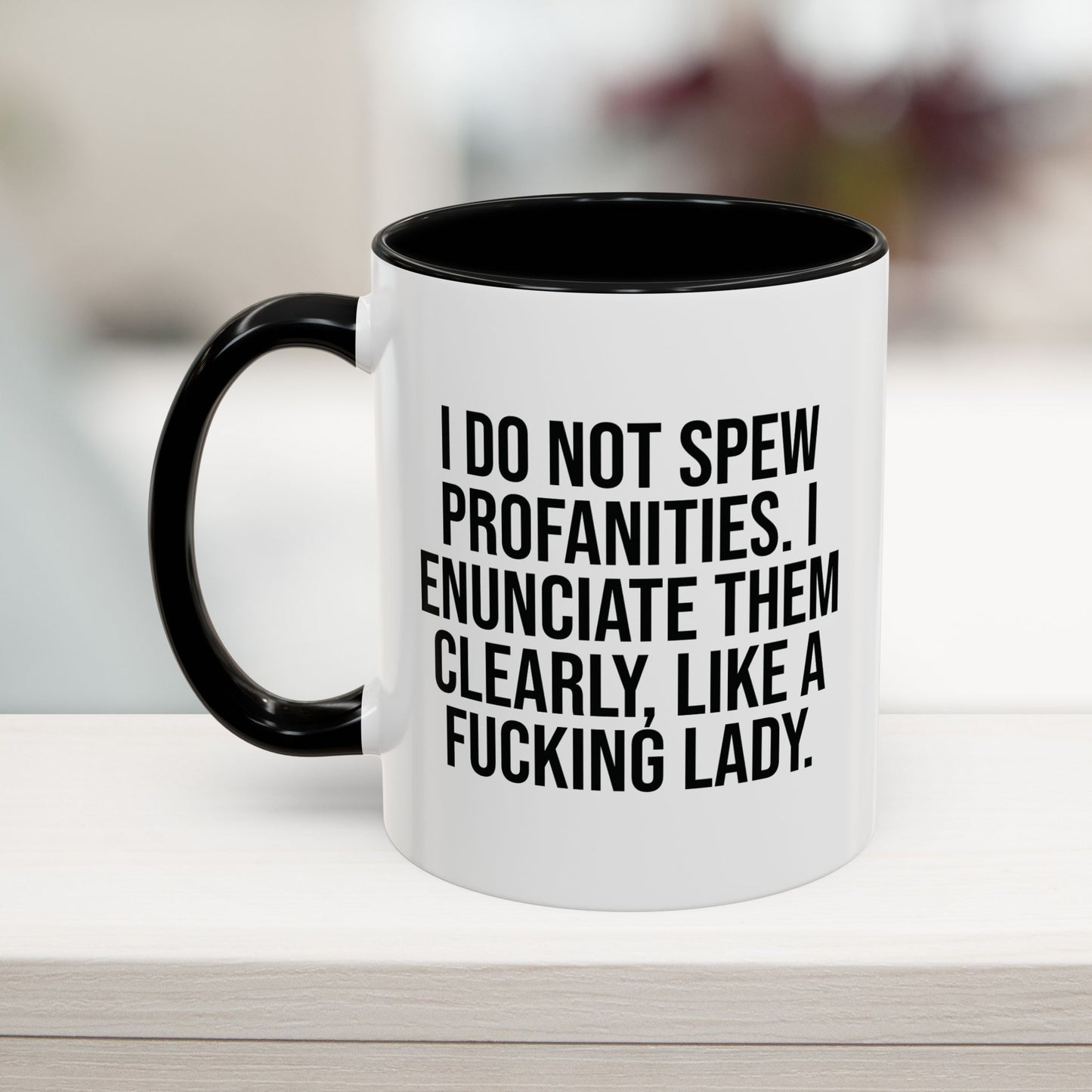 Funny profanity mug in black, 11oz, with the quote 'I do not spew profanities. I enunciate them clearly, like a fucking lady.' Perfect for a sassy coffee break.