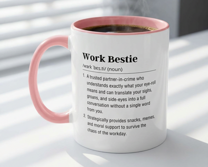Mug with pink interior and handle, featuring a definition of 'Work Bestie' on a light background.