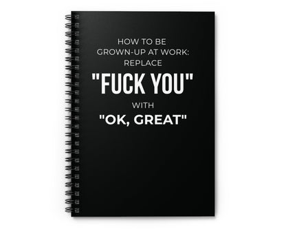 Black notebook with white text on a white background