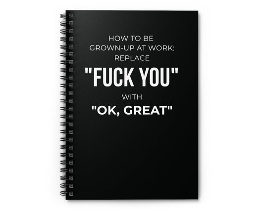 Black notebook with white text on a white background