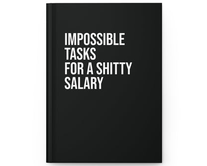 Black notebook with white text on a white background