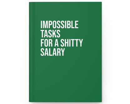Green notebook with white text on a white background