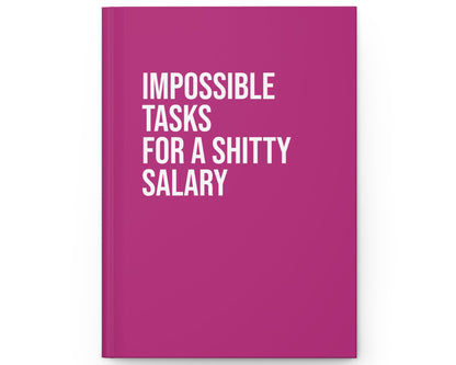 Pink notebook with white text on a white background