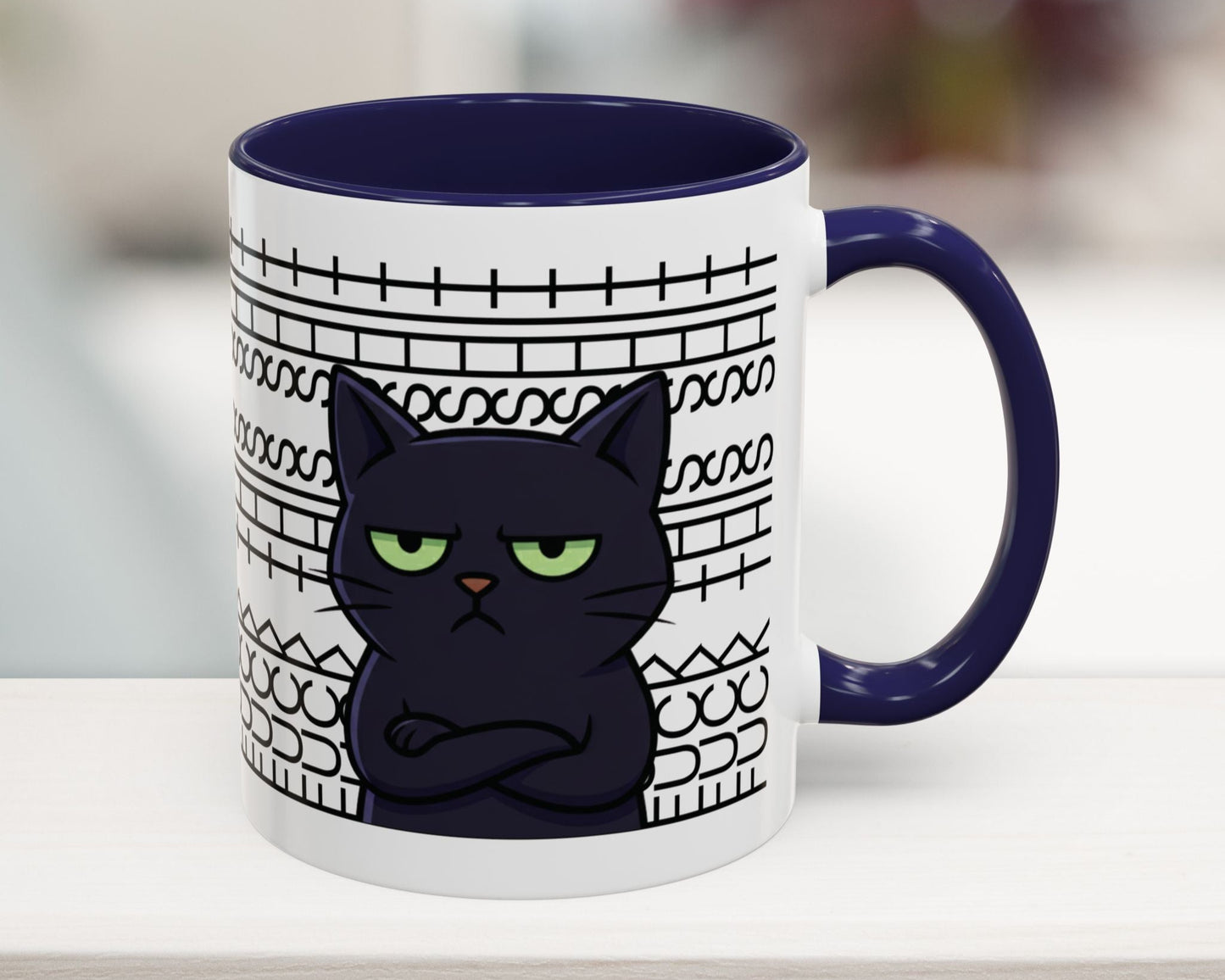 Mug with a black cat design and blue interior on a white surface