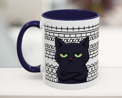 Mug with a black cat design on a white surface