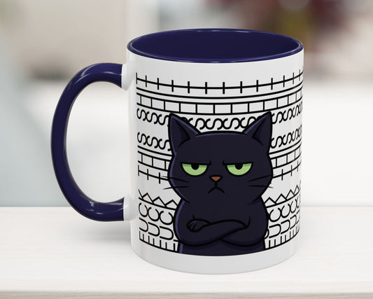 Mug with a black cat design on a white surface
