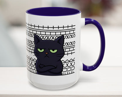 Mug with a black cat design and purple handle on a white surface