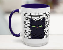 White mug with a black cat design and purple handle on a white surface.