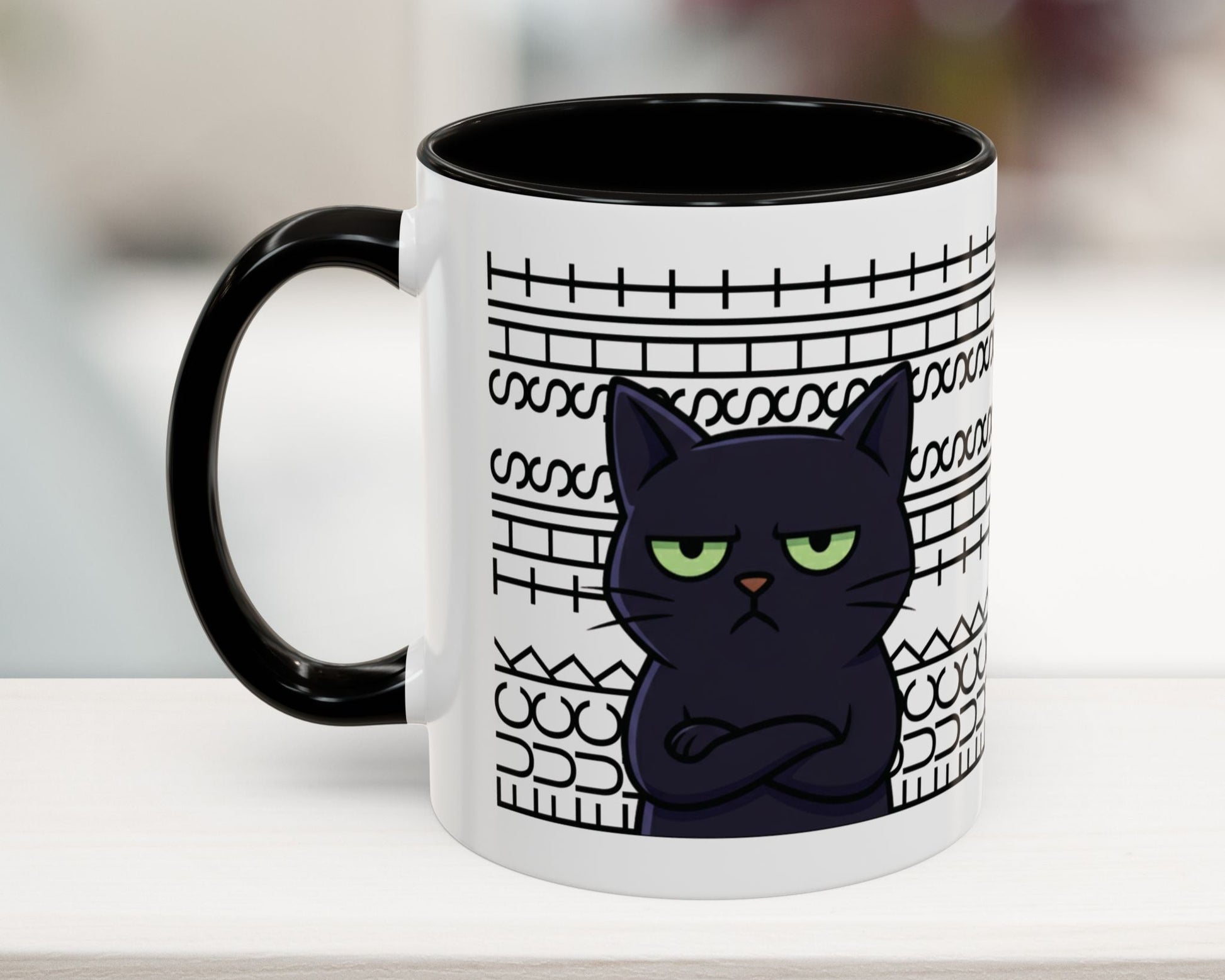 Mug with a black cat design and text on a white surface