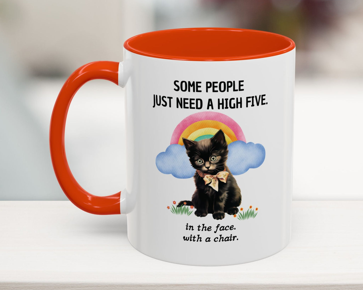 Mug with a black cat illustration and humorous text on a white surface.