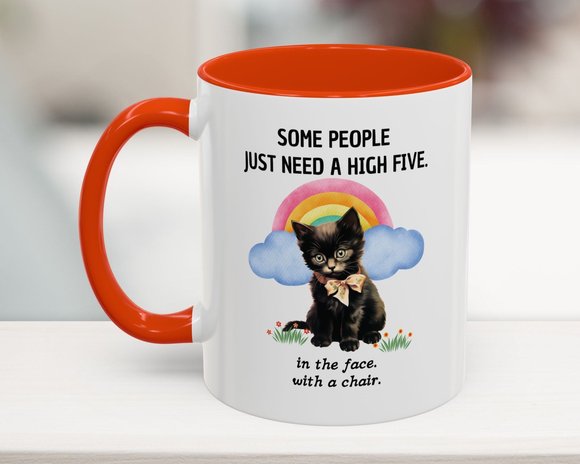 Mug with a black cat illustration and humorous text on a white surface.