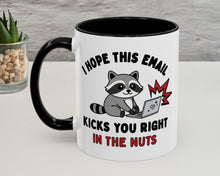 Mug with a raccoon graphic and humorous text on a white surface.