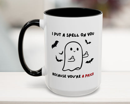 Mug with Halloween-themed design and text on a white surface