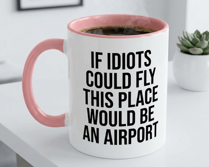 White mug with pink interior and handle, containing coffee, with humorous text on a white surface.