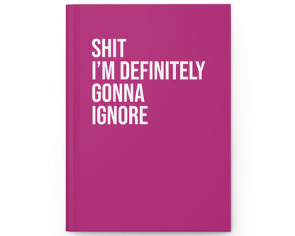Pink notebook with white text on a white background