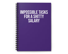 Purple notebook with white text on a white background