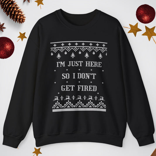 Black sweatshirt with text and patterns on a light gray background with decorative elements.