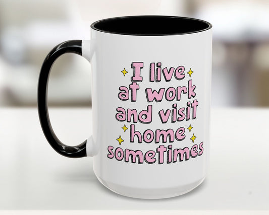 White mug with black handle featuring pink text on a blurred background