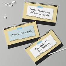 Three spiral-bound notebooks with text on a gray background
