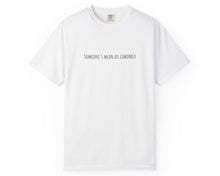 White t-shirt with black text on a white background