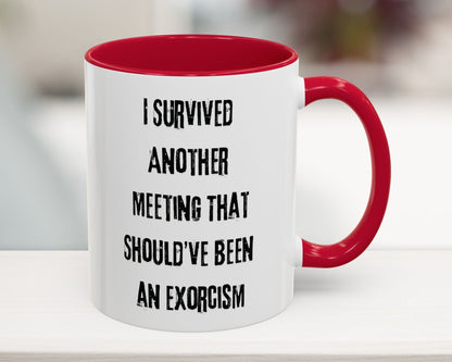 White mug with red interior and handle featuring humorous text on a blurred background