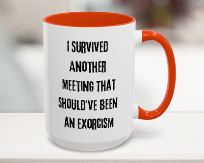 Mug with red interior and handle, featuring humorous text on a blurred background