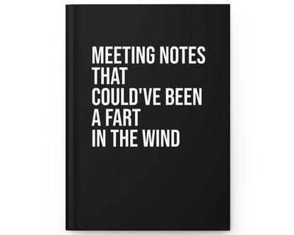 Black notebook with white text on a white background