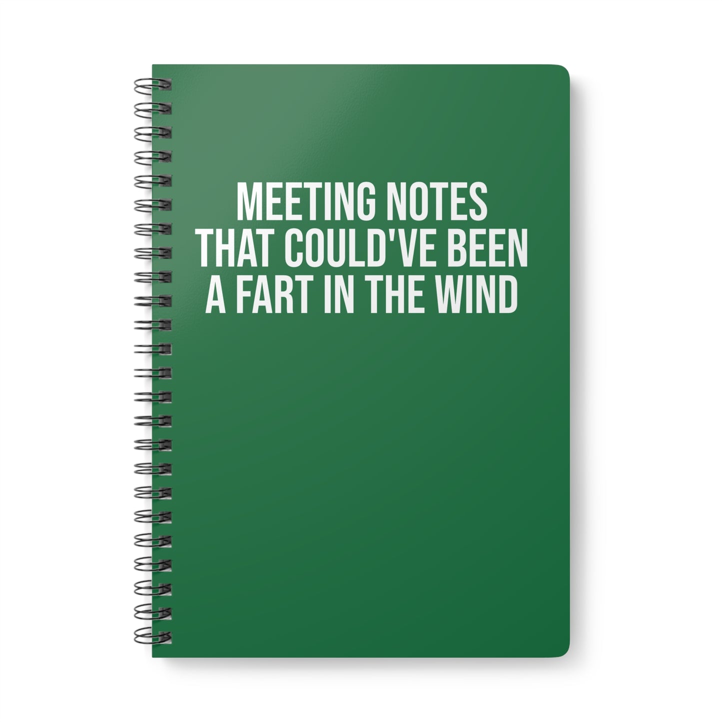 Green notebook with humorous text on a white background